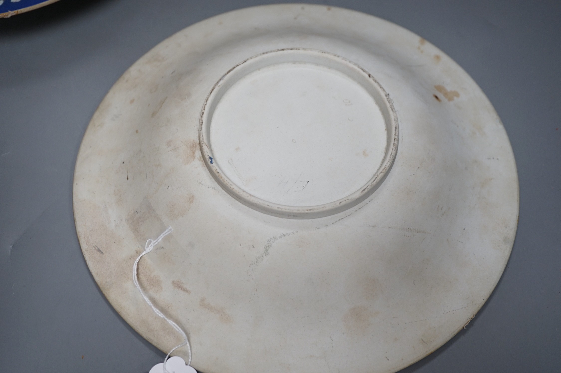 A pair of early 19th century Wedgwood jasper ware dishes, with radiating leaves from a central circle, 26cm